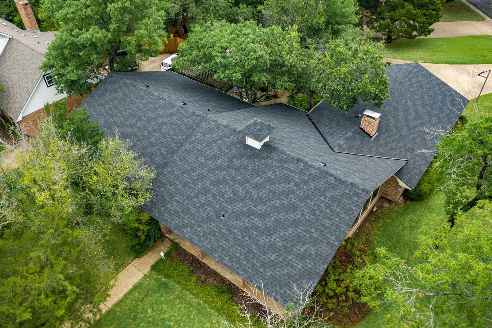 Aerial view of a completed roof on a Central Texas ranch home